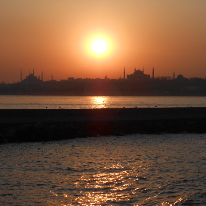 Mosques and minarets silhouetted by Istanbul sunset