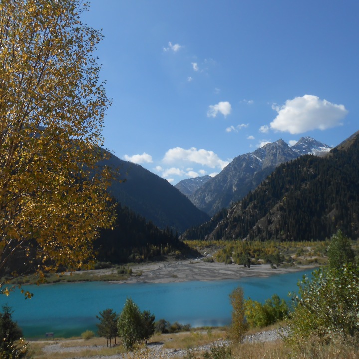 Golden fall foliage and a mountain lake in Kazakhstan